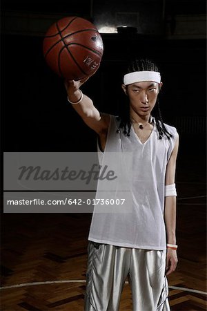 Basketball player holding basketball