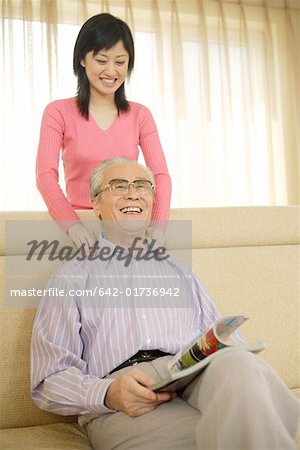 Daughter massaging for father