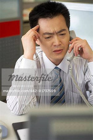 Young man calling at office