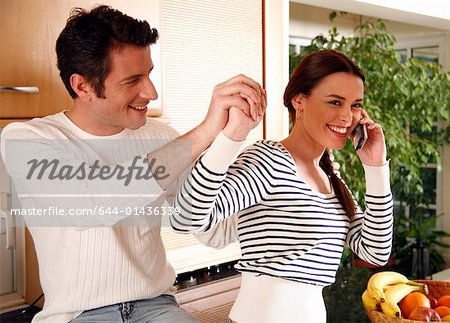 A young couple in the kitchen