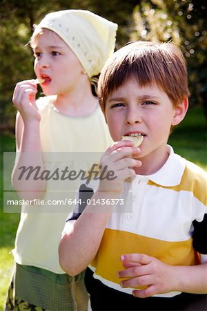 Children eating potato chips
