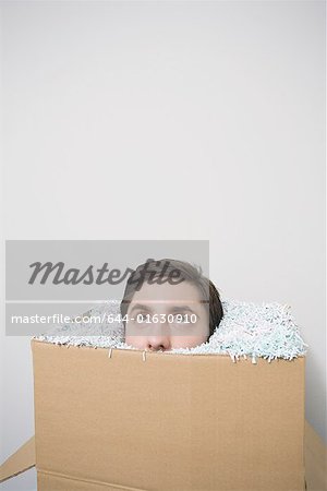 Office worker with head in a box