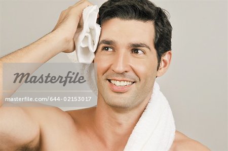 Young male adult towel drying