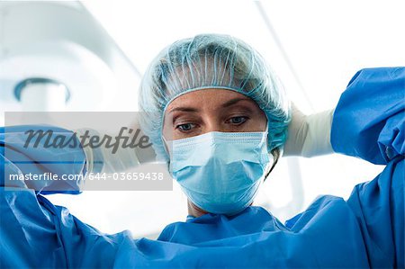 Download Surgeon Wearing Surgical Mask In Operating Room Stock Photo Masterfile Premium Royalty Free Code 644 03659438 PSD Mockup Templates