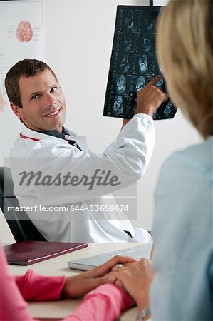 Doctor showing MRI to patient