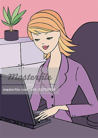 Young woman at laptop in office