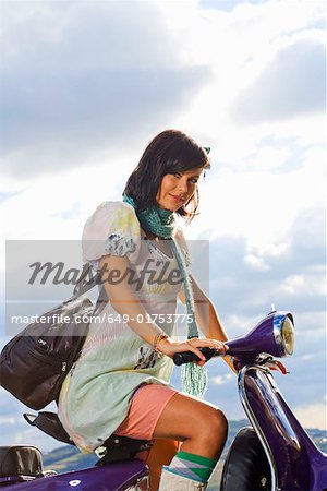 Woman on scooter.