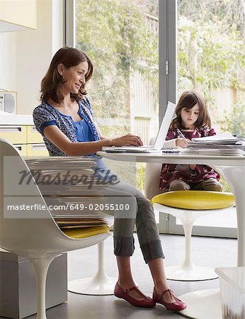 Woman running business at  kitchen table