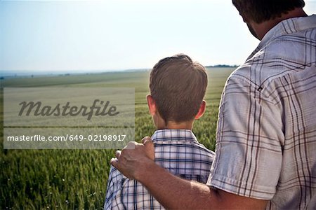 Father and son in wheat-field