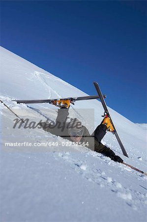 Male skier fallen over