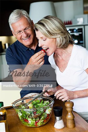 Senior Couple Preparing Salad