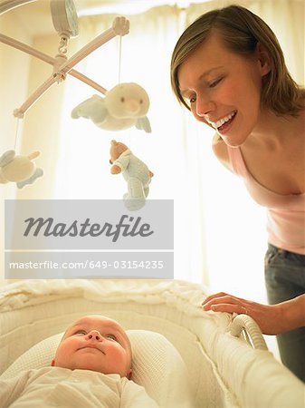 Woman smiling at baby