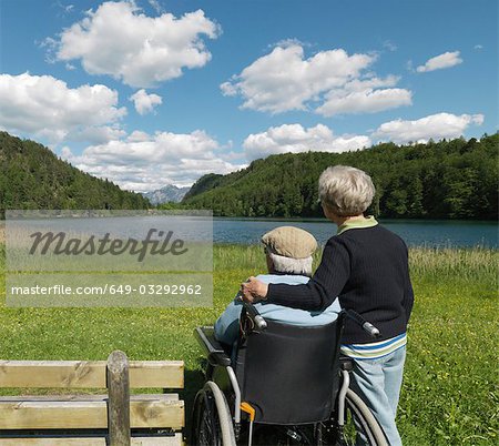 Senior couple relaxing by lake