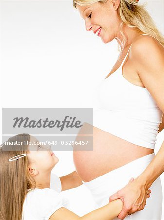 Girl with her pregnant mother