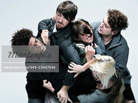 Group of adults fighting for space Group of adults fighting for space