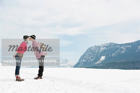 Couple kissing in front Alps