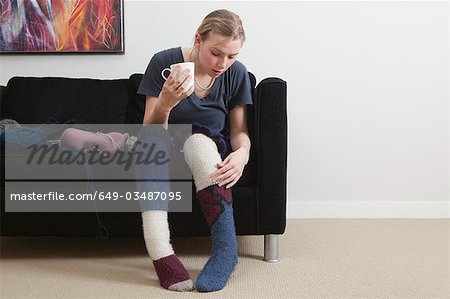 Woman admiring homemade socks