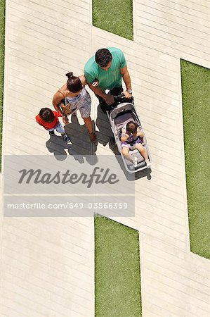 Family walking in city square