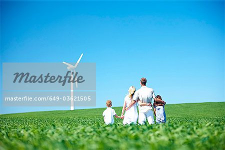 Family looking at wind turbine