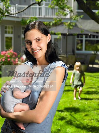 Mother and kids in the garden