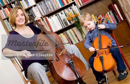 pregnant woman and boy playing Cello