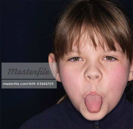 Girl sticking out tongue, close-up