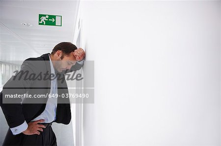 Tired businessman in an empty office