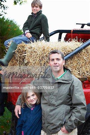 Father and children with 4x4 landrover