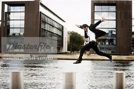 Man jumping from pole to pole