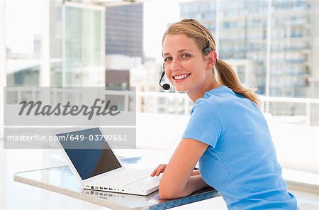 Happy businesswoman in bright office