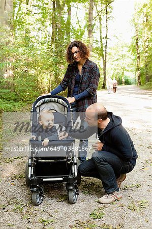 Family pushing baby in stroller