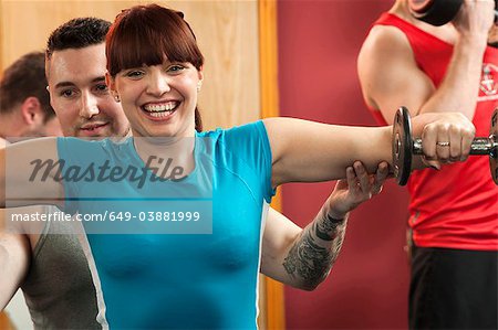 Couple exercising in gym together