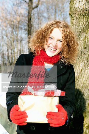 Girl carrying Christmas presents