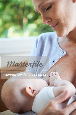 Mother breast feeding her baby