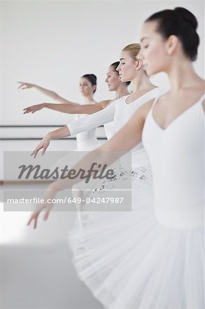 Ballet dancers posing in studio