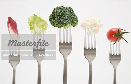 Close up of vegetables on forks