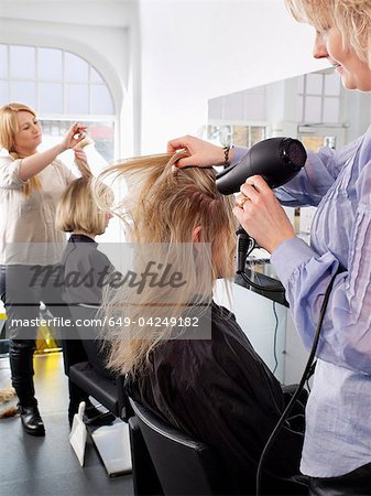 Hairdressers At Work In Salon Stock Photo Masterfile Premium