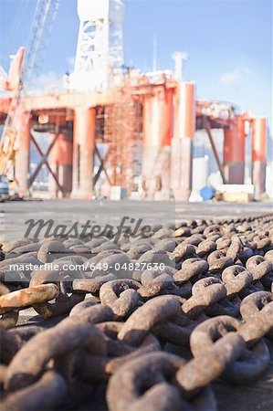 Rusted chains on oil rig