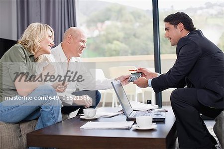 Businessman working with couple