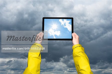 Child viewing storm on tablet computer