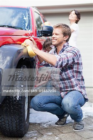 Family washing car together