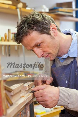 Carpenter working in shop