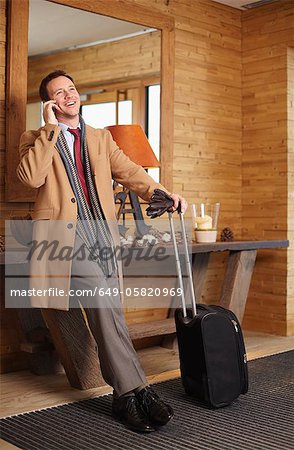 Businessman on cell phone in lobby