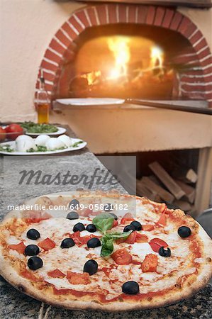 Pizza on counter in kitchen