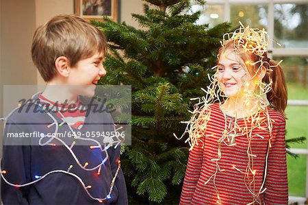 Children playing with Christmas lights