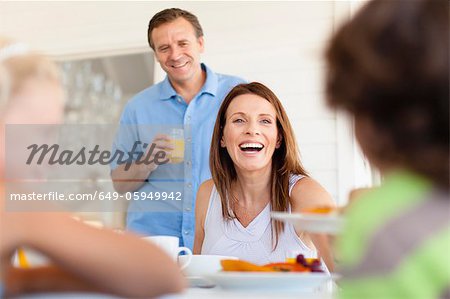 Family eating together at table