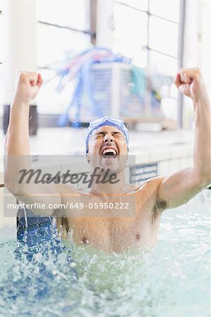 Swimmer cheering in pool