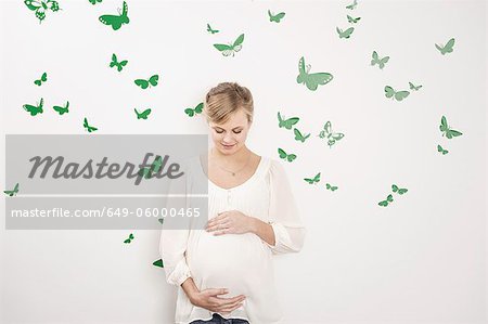 Woman holding pregnant belly