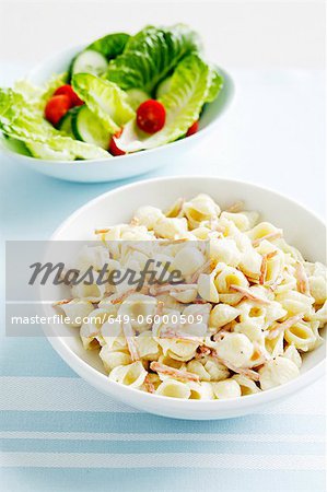Bowls of pasta and salad