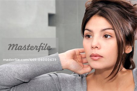 Woman styling her hair in mirror